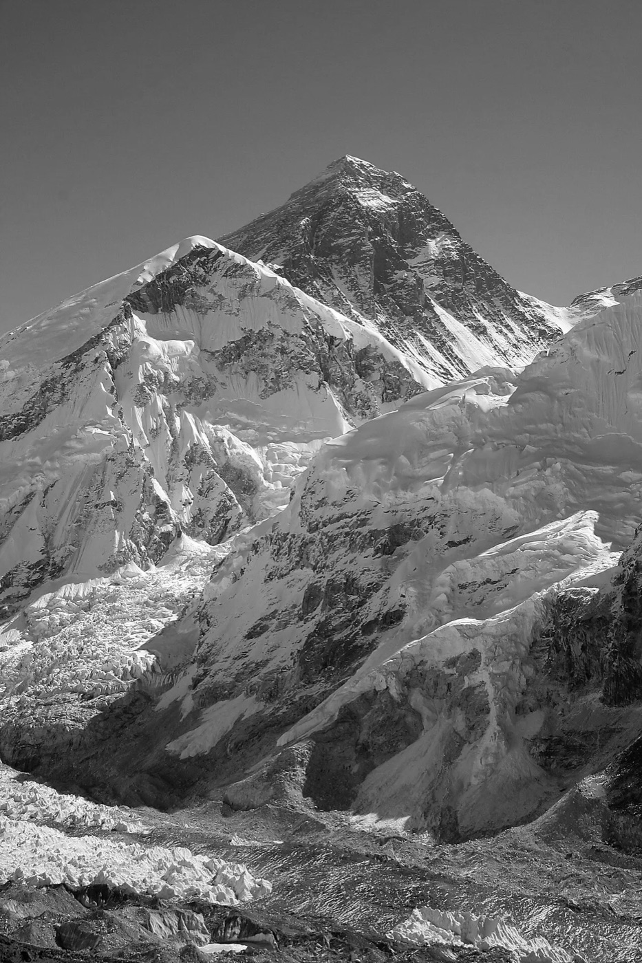 Mount Everest, black and white: one summit rising above the surrounding ridges and glacier.